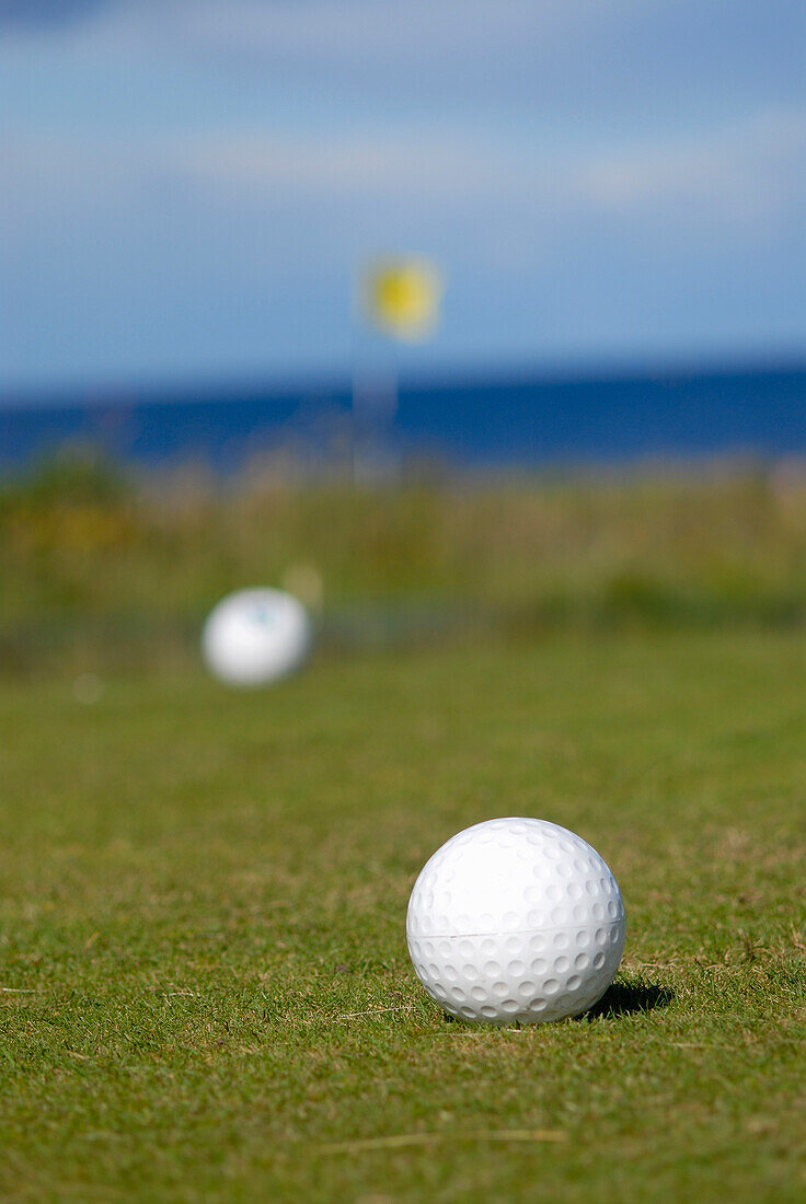 Golfbälle auf dem Grün