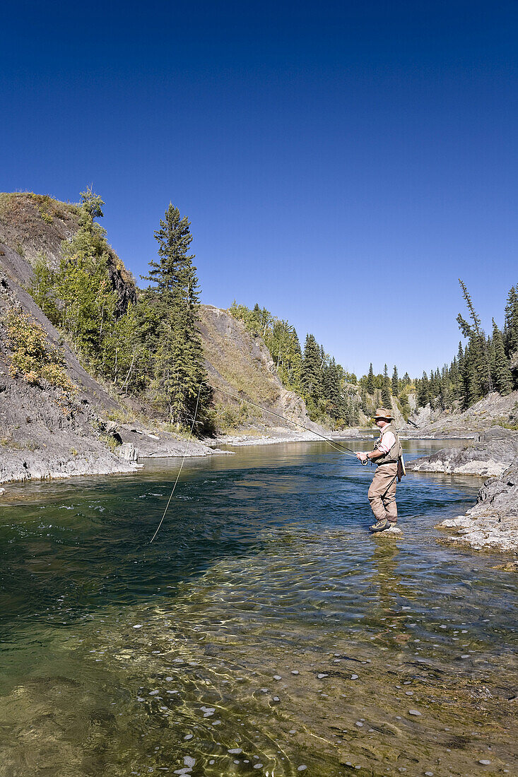 Man Fishing in River,Highwood River,Alberta,Canada