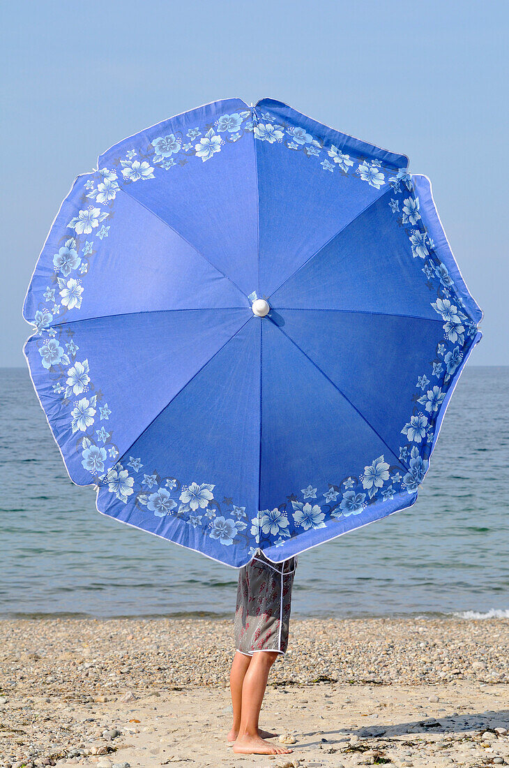 Boy with Umbrella at Beach