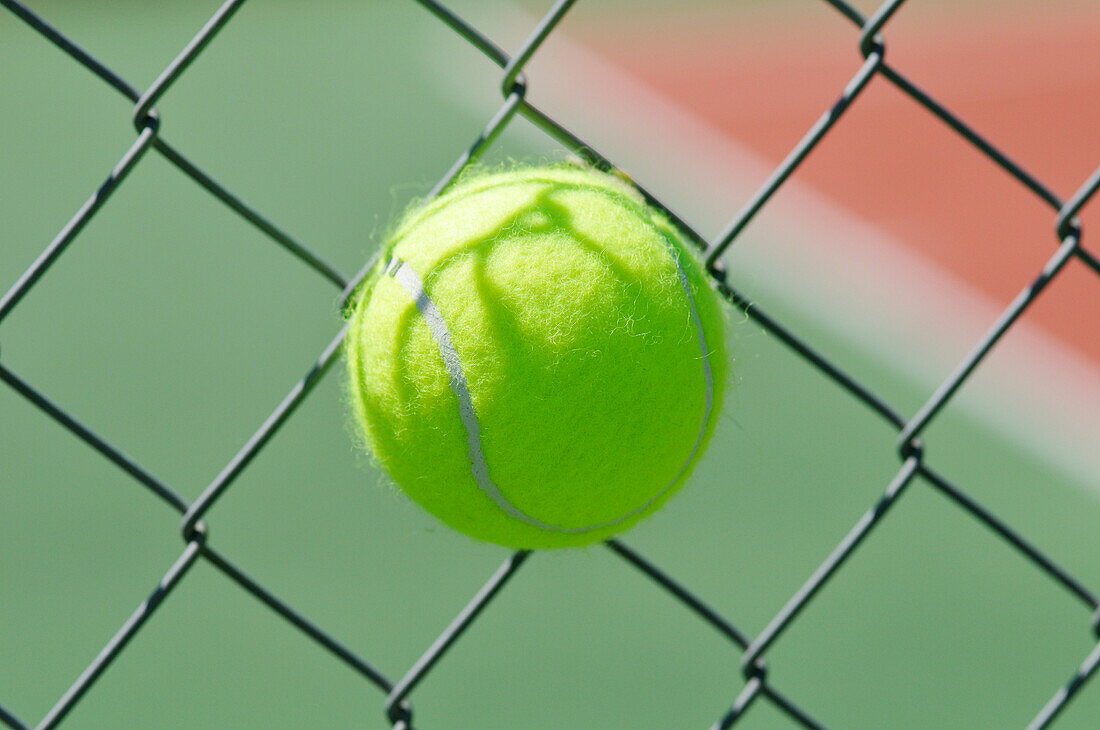 Tennis Ball Stuck in Chain Link Fence