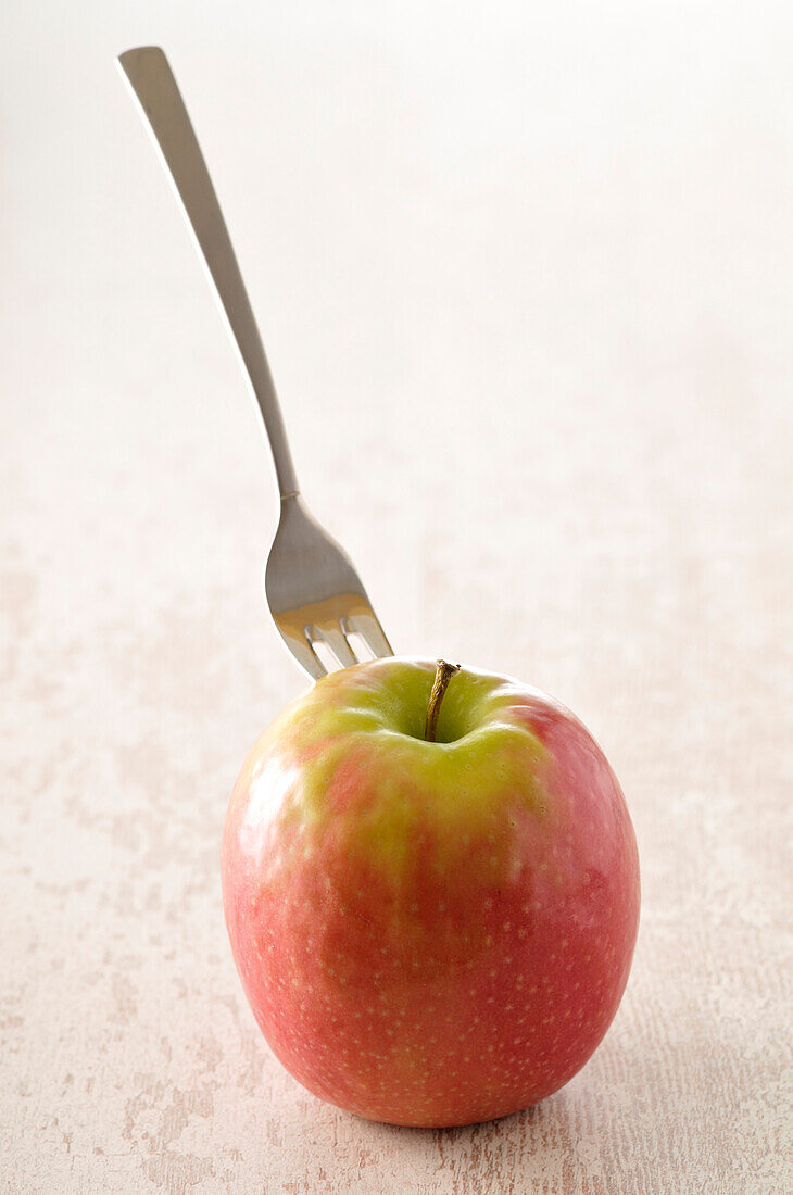 Apple with Fork in it