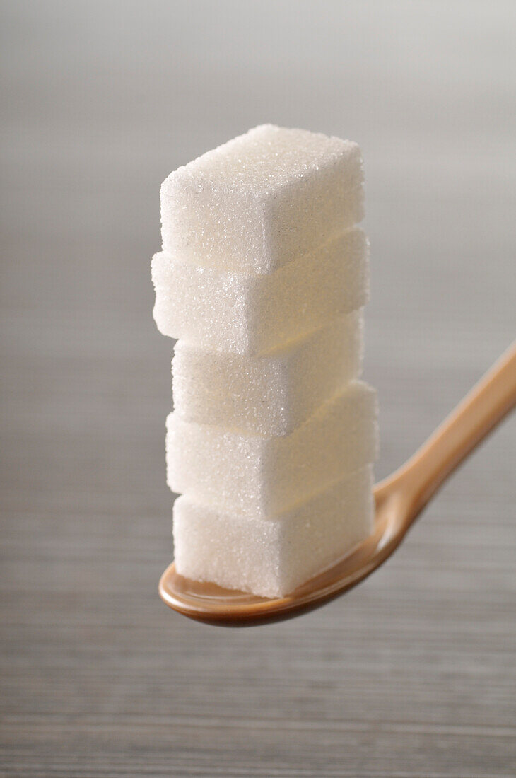 Close-up of Stack of Sugar Cubes on Spoon
