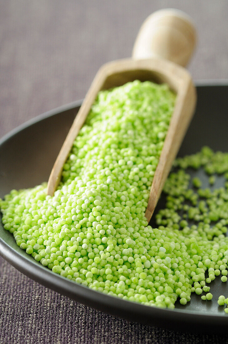 Close-up of Bowl of Quinoa with Scoop. Studio Shot