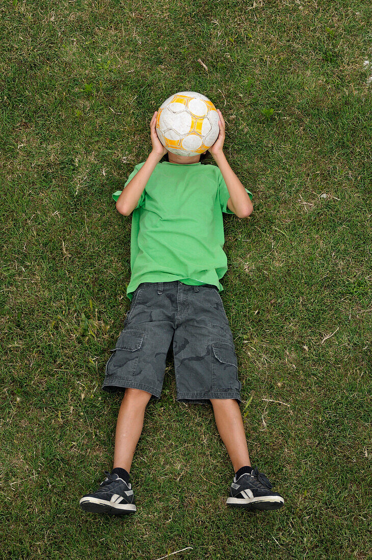 Boy Lying on Grass,Ile de Re,Poitou-Charentes,France