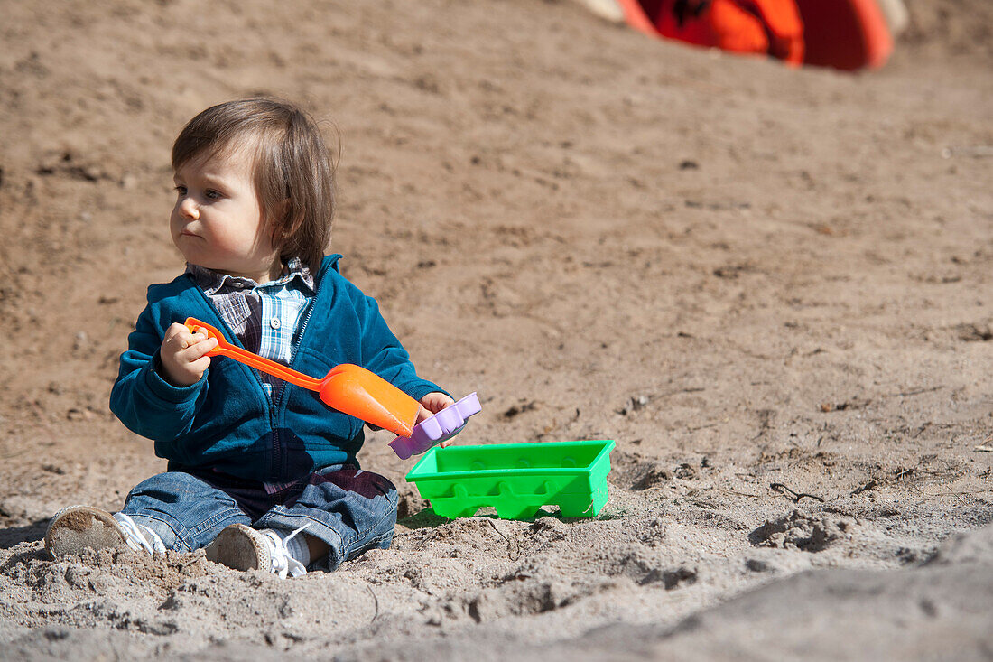 Little Boy Playing in Sand