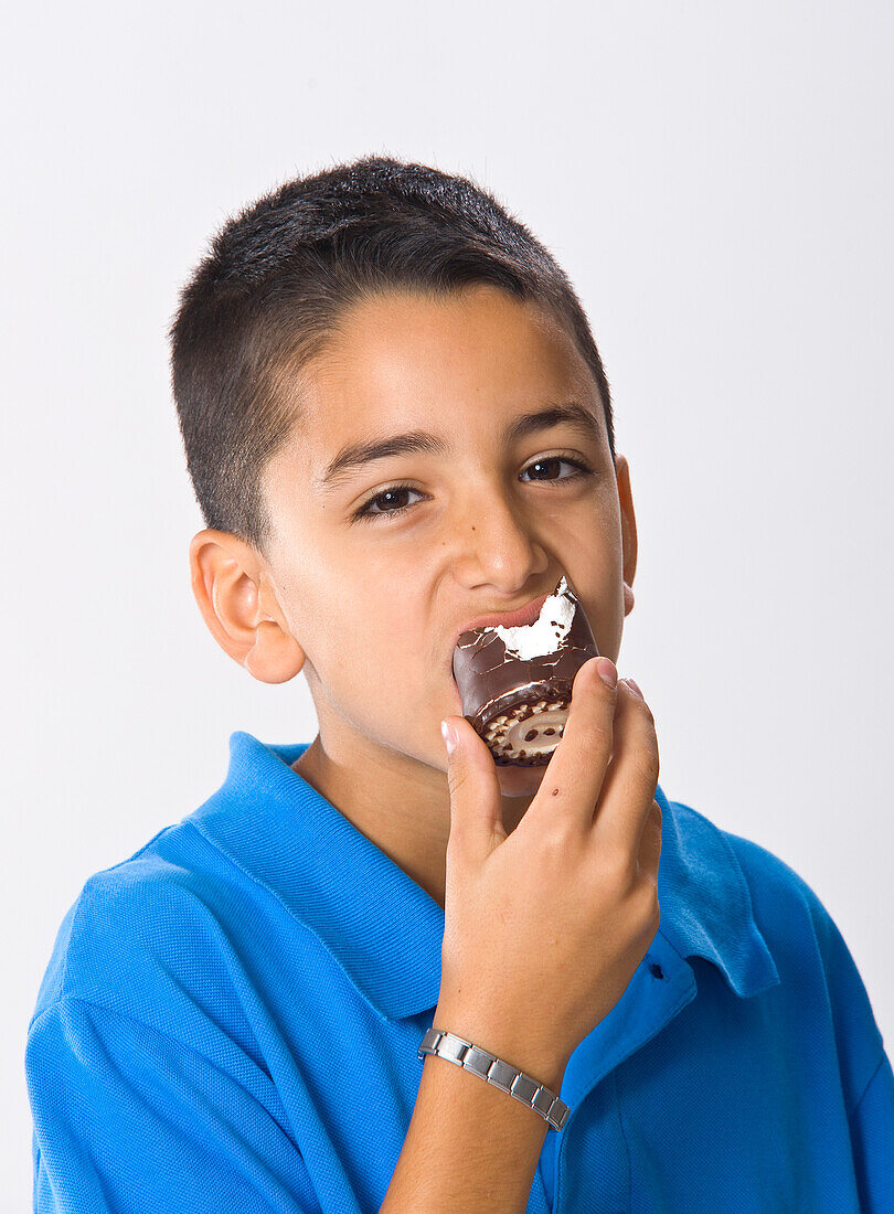 Portrait of Boy Eating Sweets