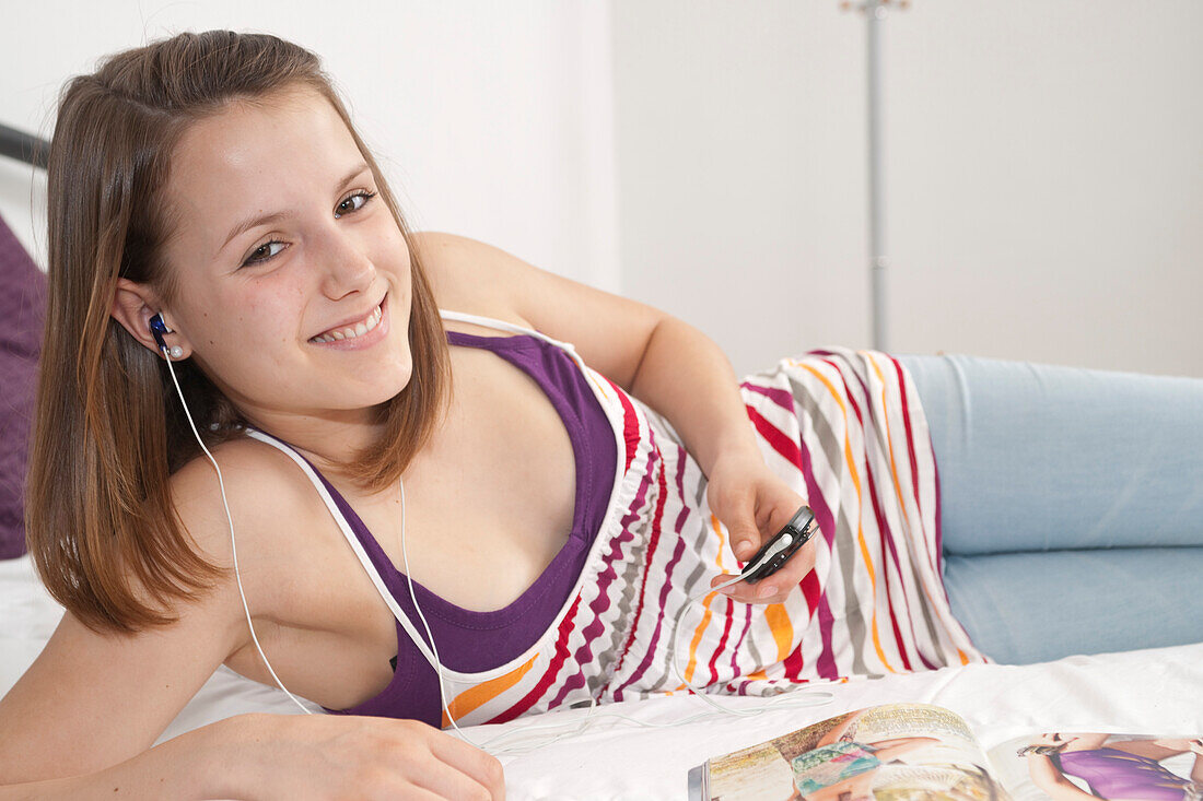 Teenage Girl Listening to MP3 Player,Mannheim,Baden-Wurttemberg,Germany
