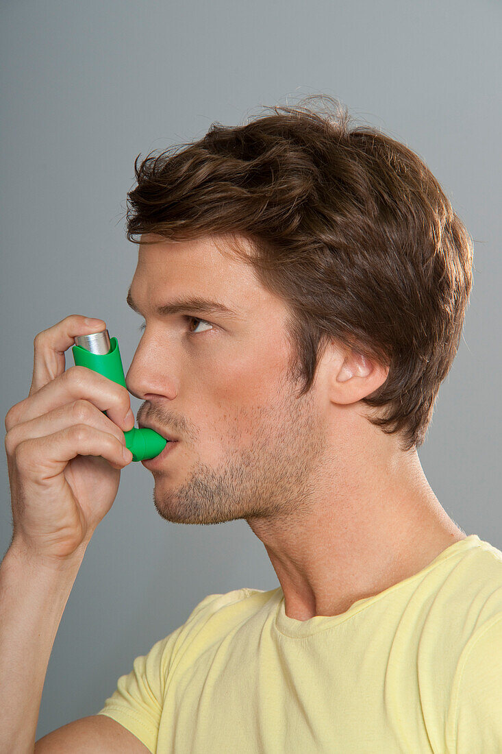 Man Using Inhaler