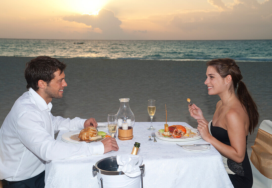 Couple Dining on Beach,Reef Playacar Resort and Spa,Playa del Carmen,Mexico