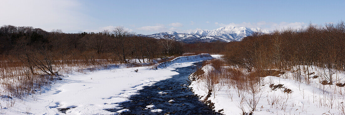 Stream through Snow-Covered Landscape,Shiretoko Peninsula,Hokkaido,Japan