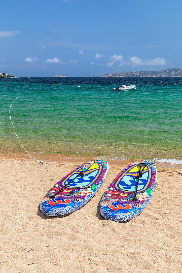 Brightly coloured paddleboards,Porto Pollo Beach,Porto Puddu,Gallura,Sardinia,Italy,Mediterranean,Europe