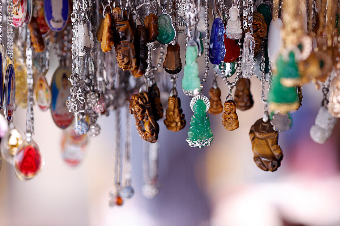 Buddhist pendants for sale in shop,Truc Lam Phung Hoang Zen Monastery,Dalat,Vietnam,Indochina,Southeast Asia,Asia
