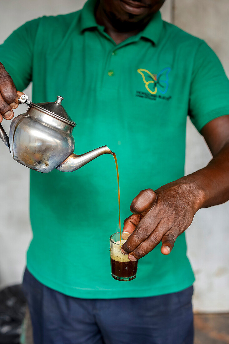 Man pouring tea in Kaolack,Senegal,West Africa,Africa