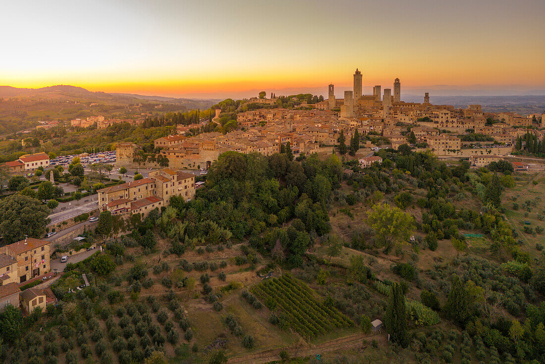 Elevated view of San Gimignano and town at sunset,San Gimignano,Tuscany,Italy,Europe