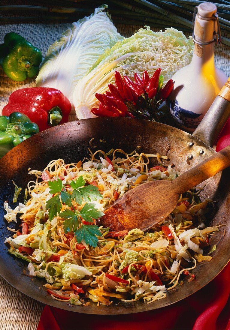 Chinese fried noodles with vegetables in wok