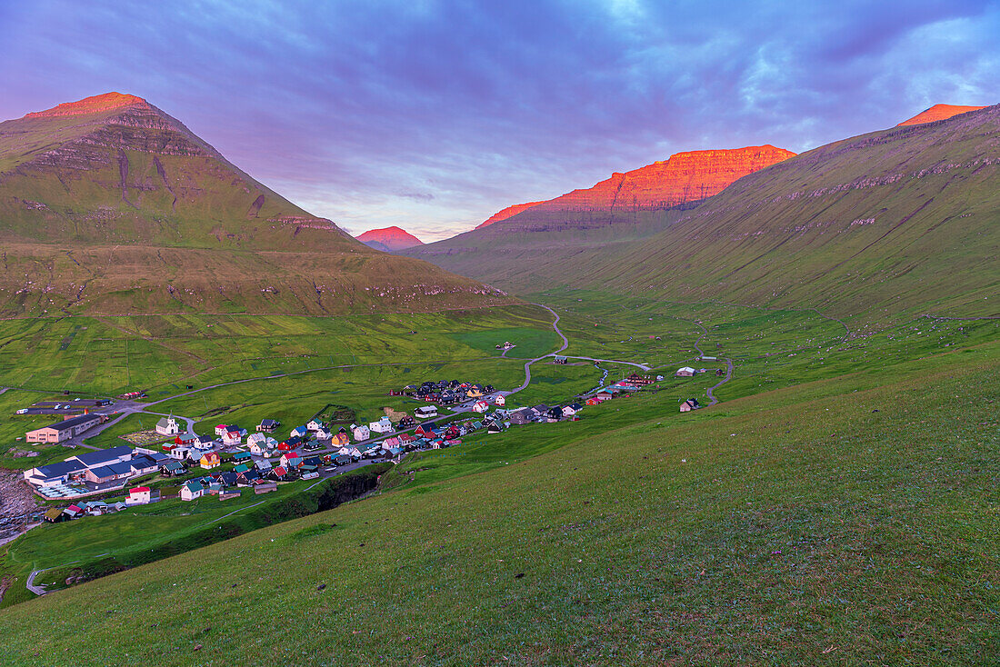 Early morning on Gjogv village with the mountain peaks lit by the sun,Eysturoy island,Faroe islands,Denmark,Europe