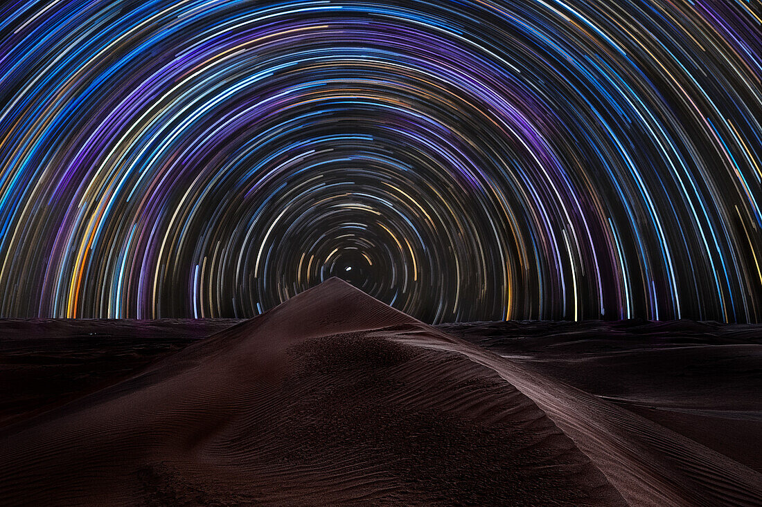 Star trail over the sand dunes of Rub al Khali desert,Oman,Middle East