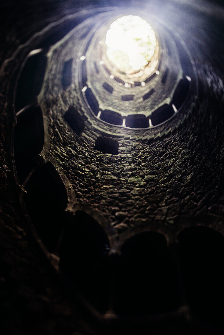 View of spiral staircases at the Initiation Well,purportedly used for ceremonial purposes by Freemasons in the 19th century,at Quinta da Regaleira,Sintra,Portugal,Europe