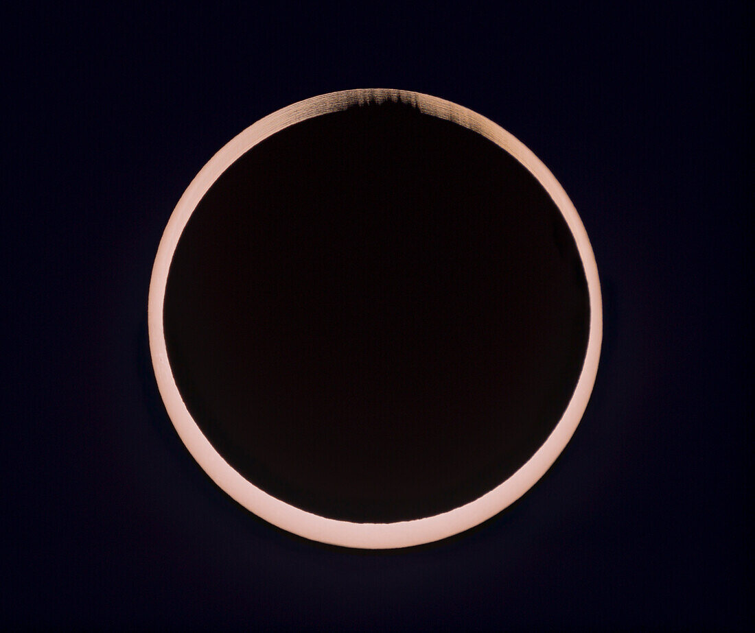 This is a composite of the October 14,2023 annular solar eclipse at second contact. It illustrates the irregular edge of the Moon breaking up the rim of sunlight as the dark disk of the Moon became tangent to the inner edge of the Sun at second contact at the start of annularity. This is a blend of fifteen exposures taken over 20 seconds at second contact.