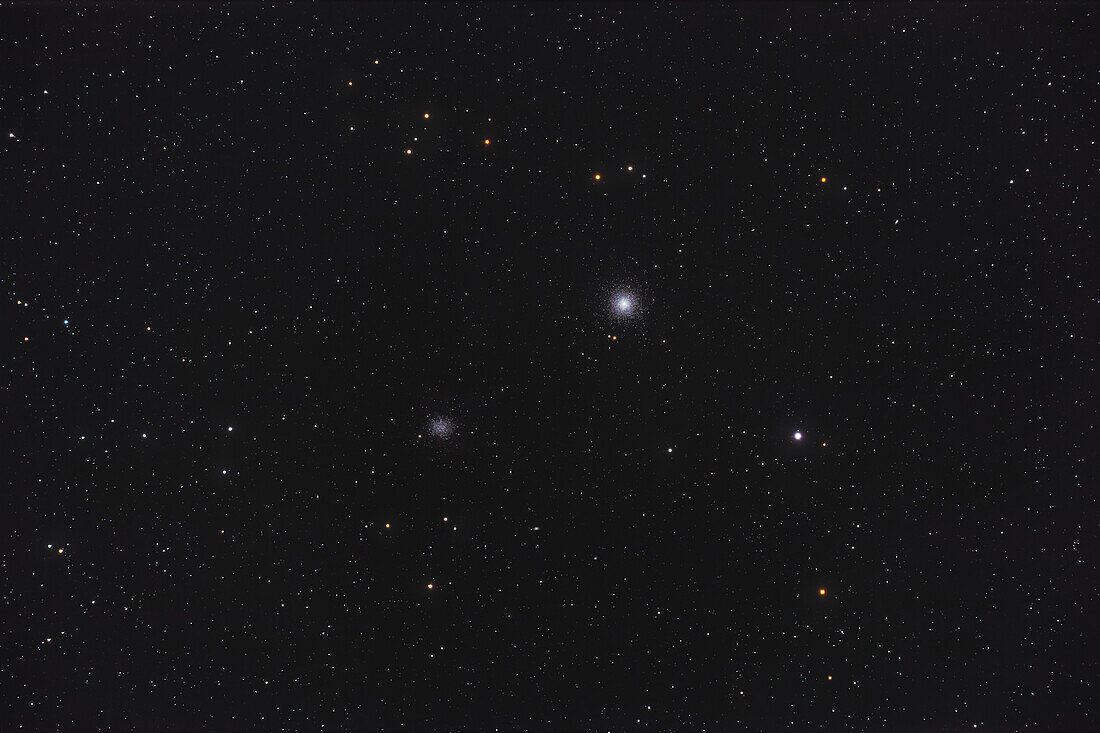 This is the pair of mismatched globular star clusters,Messier 53 (on the right) and NGC 5053 in Coma Berenices. M53 is a rich cluster while NGC 5053 is fainter and rather poorly populated. The difference is intrinsic as both clusters lie about the same distance away,some 53,000 light years. The brightest star at lower right is Diadem,or Alpha Comae Barenices. A number of faint and tiny IC,PGC and UGC galaxies dot the field.