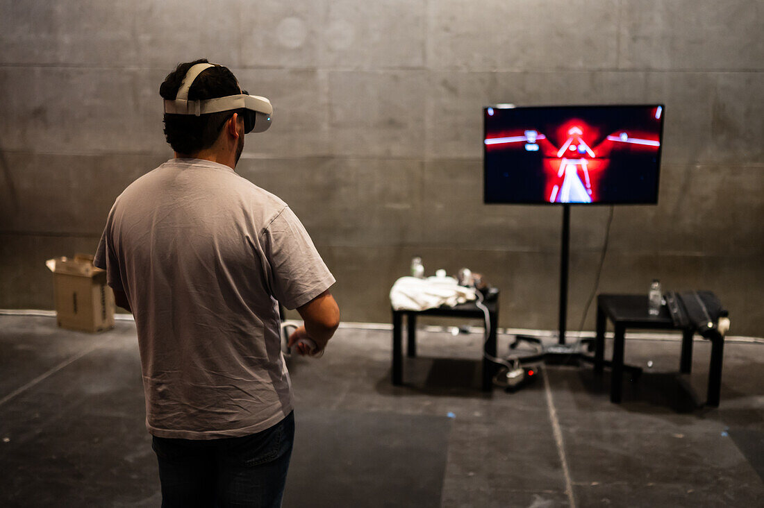 Young man playing with Meta Quest 2 all-in-one VR headset during ZGamer,a festival of video games,digital entertainment,board games and YouTubers during El Pilar Fiestas in Zaragoza,Aragon,Spain