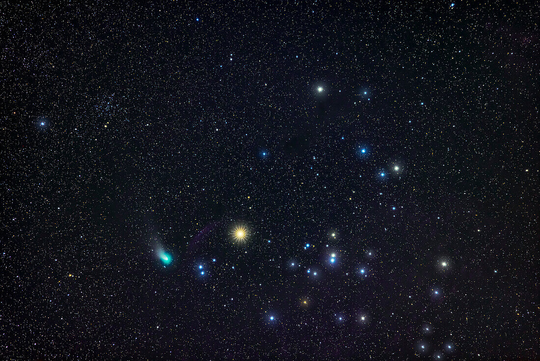 A portrait of green Comet C/2022 E3 (ZTF) in Taurus beside Aldebaran and the Hyades on February 14,2023. The star cluster NGC 1647 is at upper left.