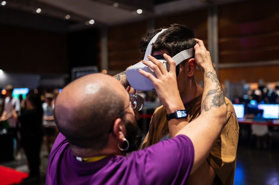 Teenager playing with Meta Quest 2 all-in-one VR headset during ZGamer,a festival of video games,digital entertainment,board games and YouTubers during El Pilar Fiestas in Zaragoza,Aragon,Spain