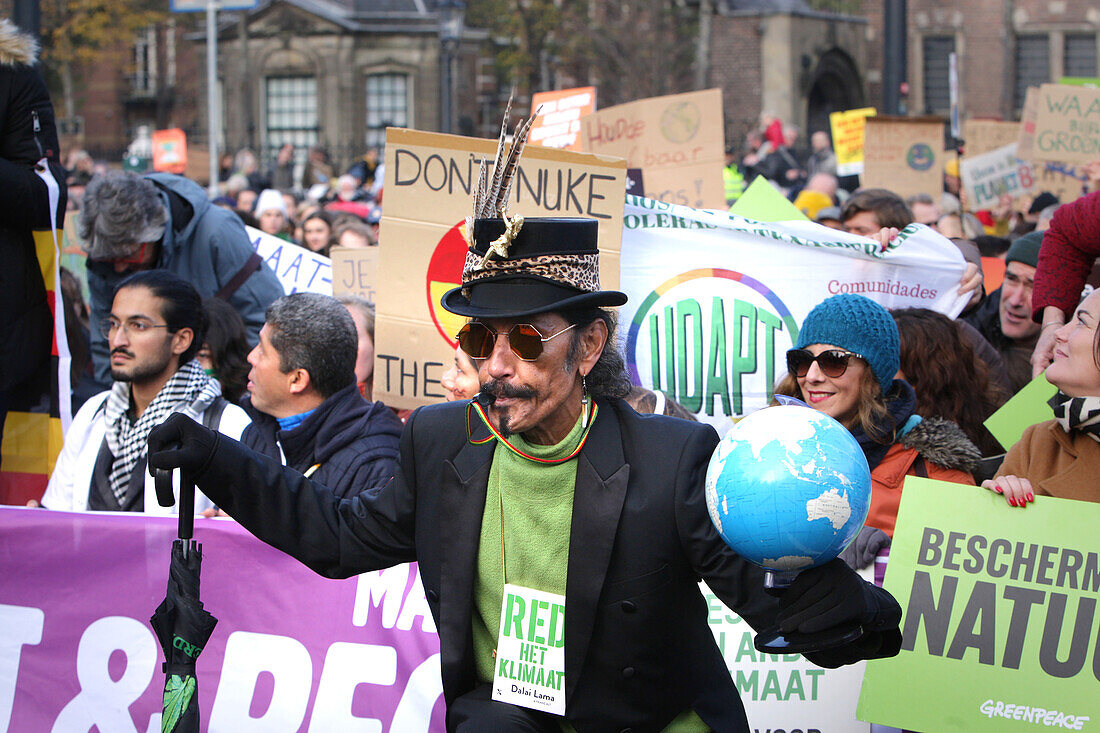 Environmental activists and supporters attend the March For Climate And Justice on November 12,2023 in Amsterdam,Netherlands. Protestors demand action from the Dutch government and world leaders to combat the climate change crisis,heat records are being broken again and again,resulting in profound changes for all life on Earth. An estimated 70,000 people have walked on Sunday with the climate march in Amsterdam,according to the Amsterdam municipality.