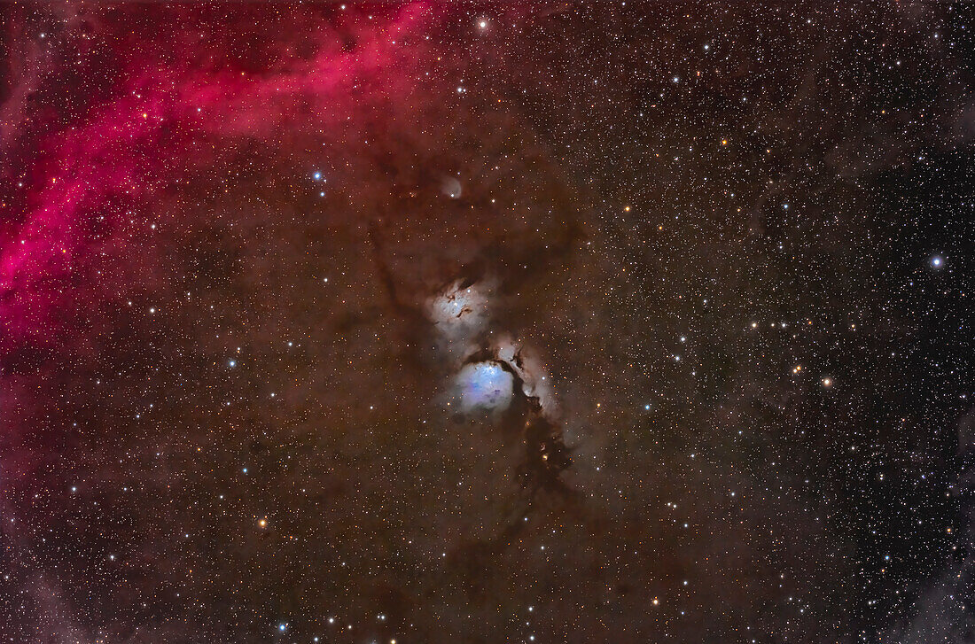 The dusty blue reflection nebulas Messier 78 (bottom) and NGC 2071 (top) in Orion near the red arc of Barnard's Loop at left. A fan-shaped reflection nebula above NGC 2071 is not identified on any charts I had. Dark dust lanes run through the region and colour the sky brown. The tiny variable nebula known as McNeil's Nebula is below M78. Remarkably,some small 16th magnitude galaxies in the PGC catalog are recorded amid the dust at upper right in the frame.