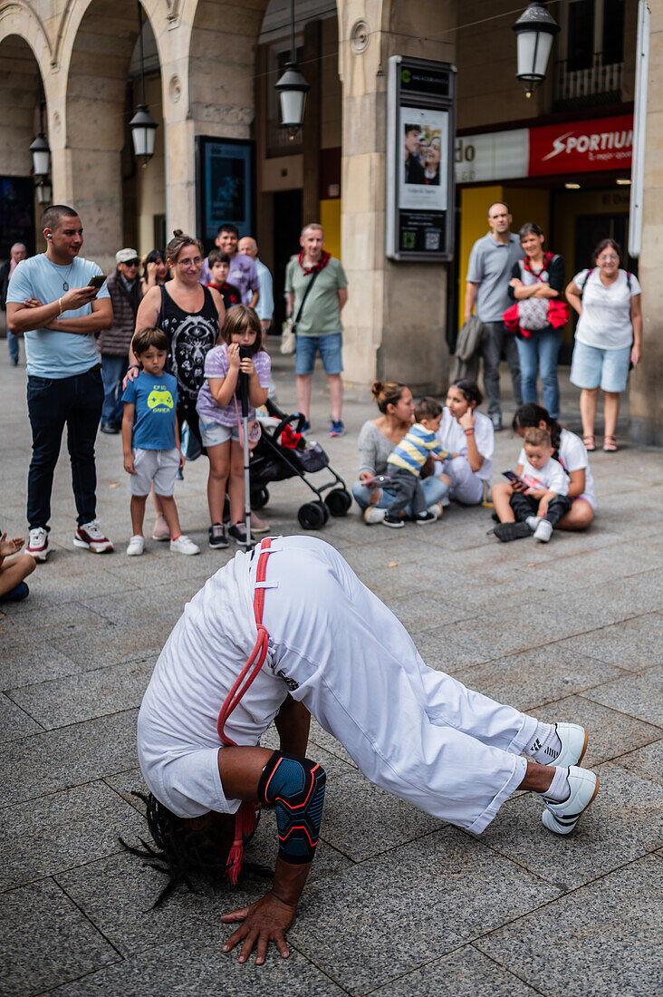 Members of Mestre Branco Capoeira Escola demonstrate in the street during the Fiestas of El Pilar in Zaragoza,Aragon,Spain