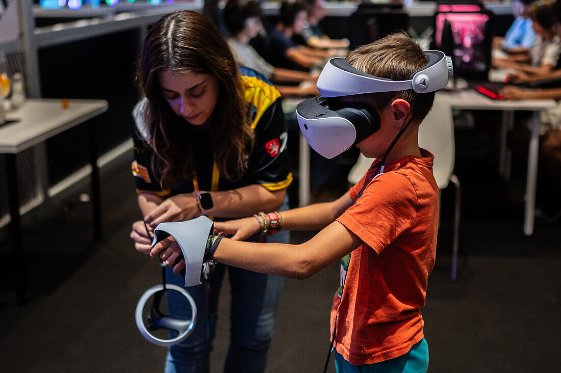 Young boy playing with Meta Quest 2 all-in-one VR headset during ZGamer,a festival of video games,digital entertainment,board games and YouTubers during El Pilar Fiestas in Zaragoza,Aragon,Spain