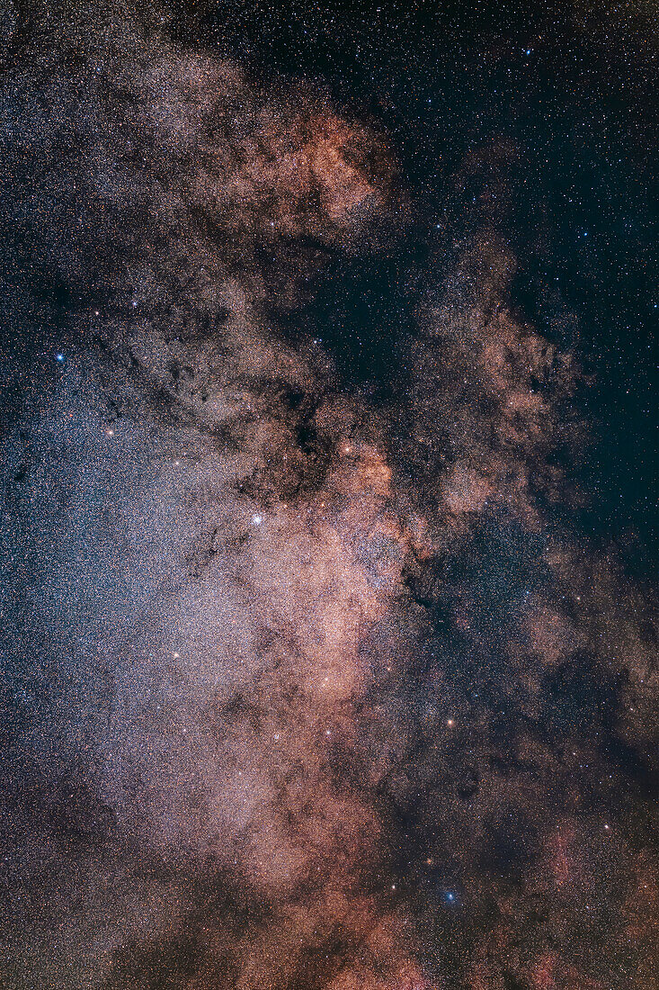 This frames the bright Scutum Starcloud at centre and surrounding region of the Milky Way,with the bright starfields contrasting with the dark lanes and obscuring dust in this region of the Milky Way. The bright star cluster Messier 11,or the Wild Duck Cluster,is left of centre embedded in the Starcloud. The smaller star cluster M26 is below it. At bottom right,the star cluster set in a dark lane and above the blue star is NGC 6649. That blue star has a small reflection nebula around it,IC 1287.