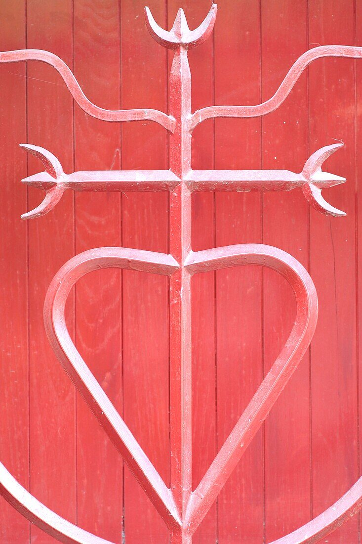 France, Gard, Petite Camargue, Aigues-Mortes, Camargue cross at the shutter of a house