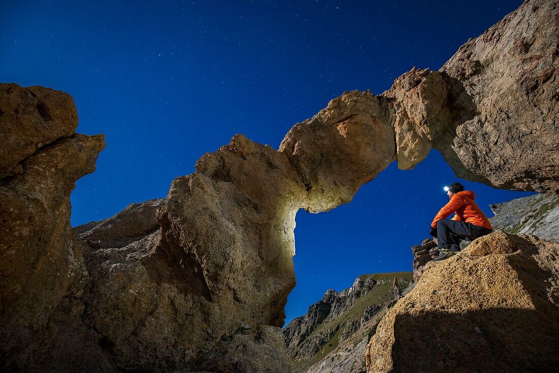 France, Alpes-Maritimes, Mercantour National Park, the Tortisse Arch (2550m) illuminated by the moon