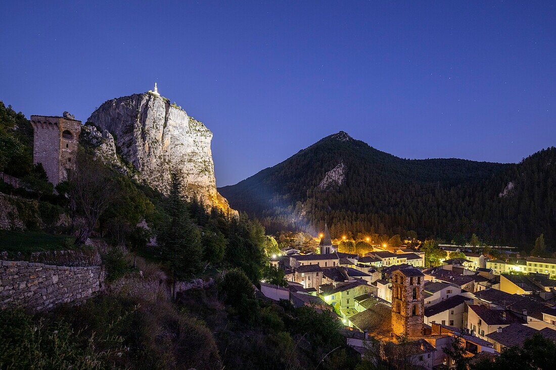 France, Alpes-de-Haute-Provence, Regional Natural Park of Verdon, Castellane, view of the city rooftops at the foot of the Roc site (911m) with the Notre-Dame du Roc chapel at the top, the pentagonal tower on the left, the Sacré Coeur church and the bell tower of the Saint Victor church