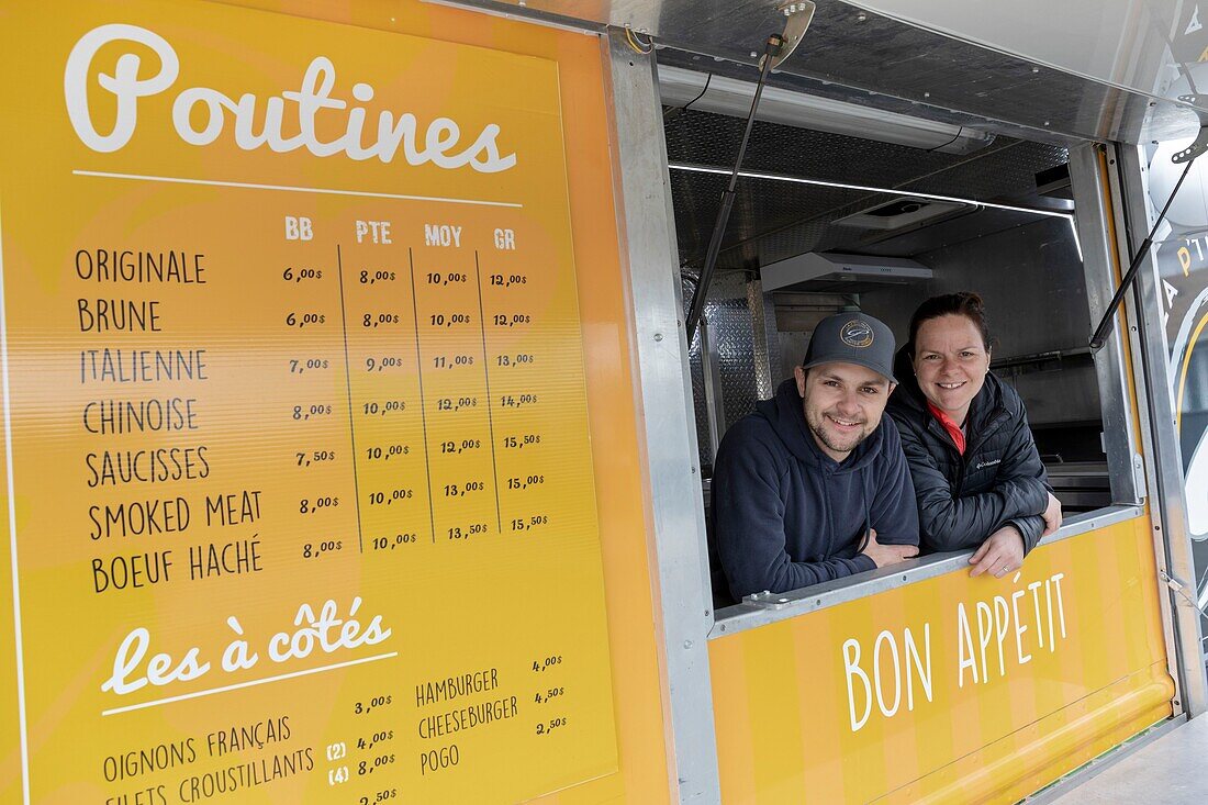 Canada, Province of Quebec, Centre-du-Québec region, in the footsteps of the invention of poutine, Princeville, the La P'tite Vache catering truck, Jessica and Jonathan Lamontagne the owners