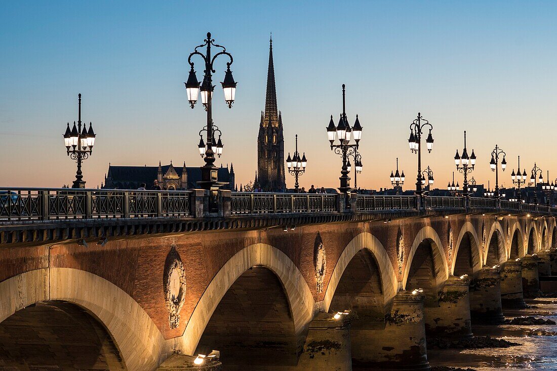 France, Gironde, Bordeaux the stony bridge steps over the Garonne since 1822, its lampposts in the twilight owe him a part its fame