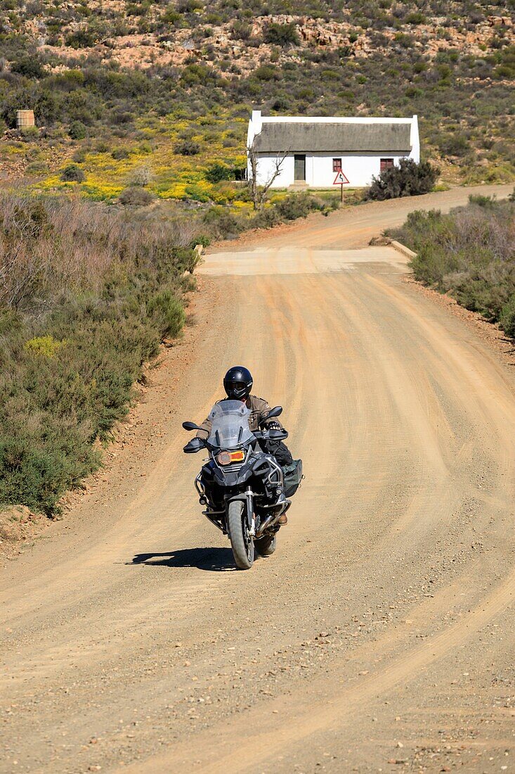 South Africa, Western Cape, Biker on a track in the Cederberg