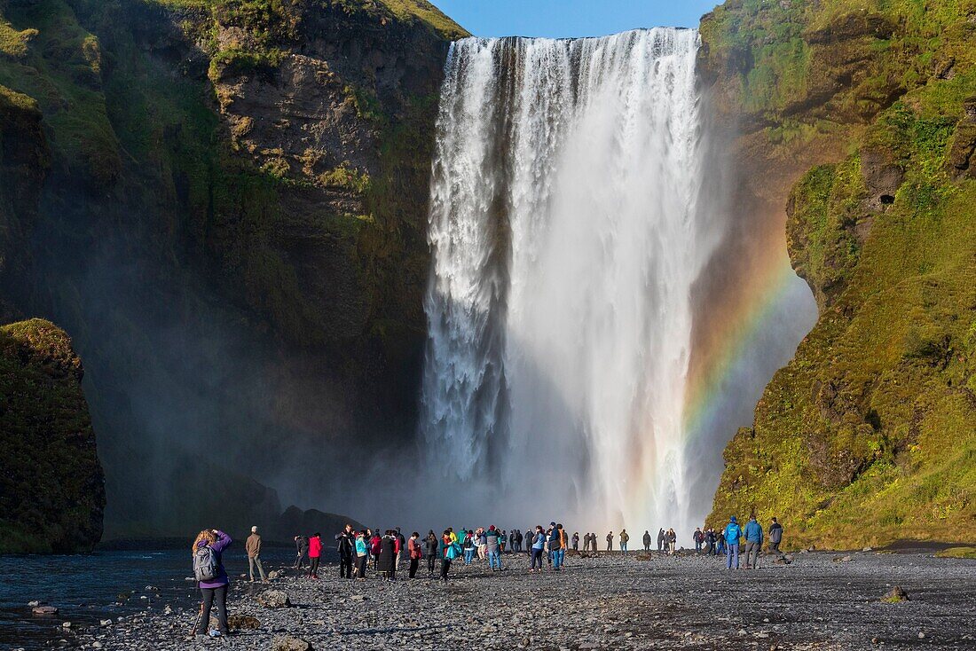 Iceland, South Iceland, Skogar, Rainbow in front of Skogafoss