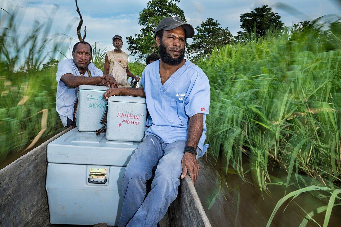 Papua New Guinea, East Sepik province, Sepik River region, Angoram district, Samban village, Samban health center nurses canoe the most remote areas of the region to participate in the vaccination campaign against poliomyelitis on the Sepik River during the operation to eradicate the epidemic in 2019