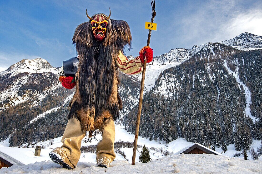 Switzerland, Valais, Lotschental valley, Wiler, Tschaggatta Carnival, costumes are made from animal skins, wooden masks and horse hair