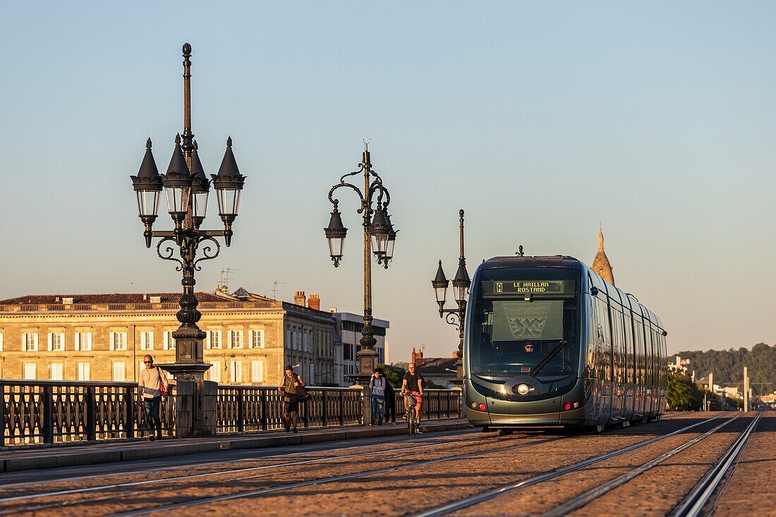 France, Gironde, Bordeaux, area classified as World Heritage by UNESCO, tram of the TBM network on the Pont de Pierre over the Garonne, brick and stone arch bridge inaugurated in 1822