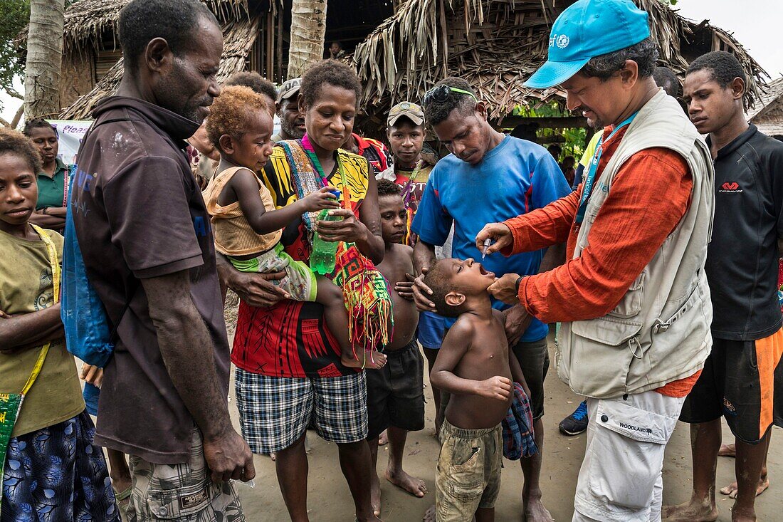 Papua New Guinea, East Sepik Province, Sepik River Region, Kambaramba Village, UNICEF Coordinator Pradipta Ojha Participates in Mass Poliomyelitis Vaccination During the 2019 Eradication Campaign