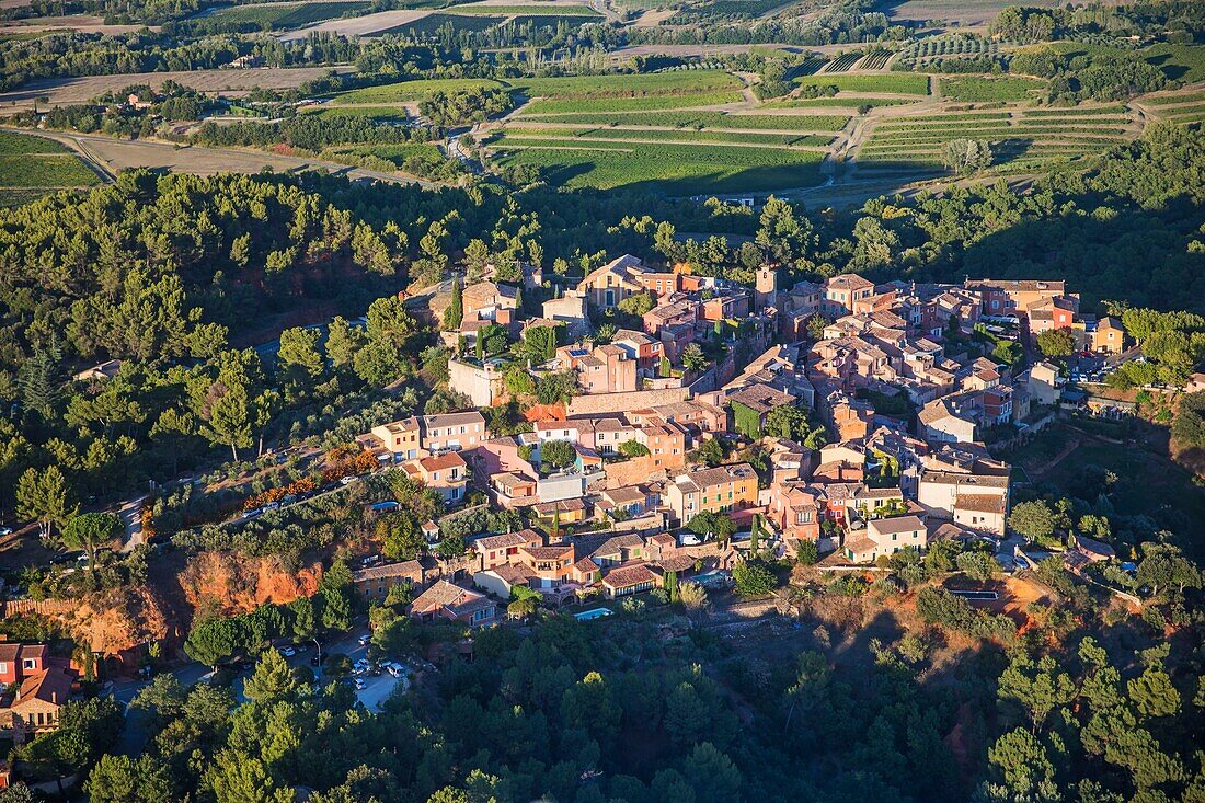 France, Vaucluse, regional natural park of Luberon, Roussillon, labeled the most beautiful villages of France (aerial view)