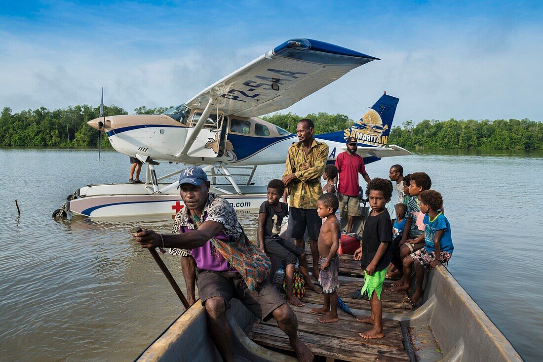 Papua New Guinea, East Sepik Province, Sepik River Region, Seaplane evacuation of Samaritan Aviation Missionary Company of sick woman from Sepik River area after polio vaccine delivery of eradication campaign of the outbreak in 2019