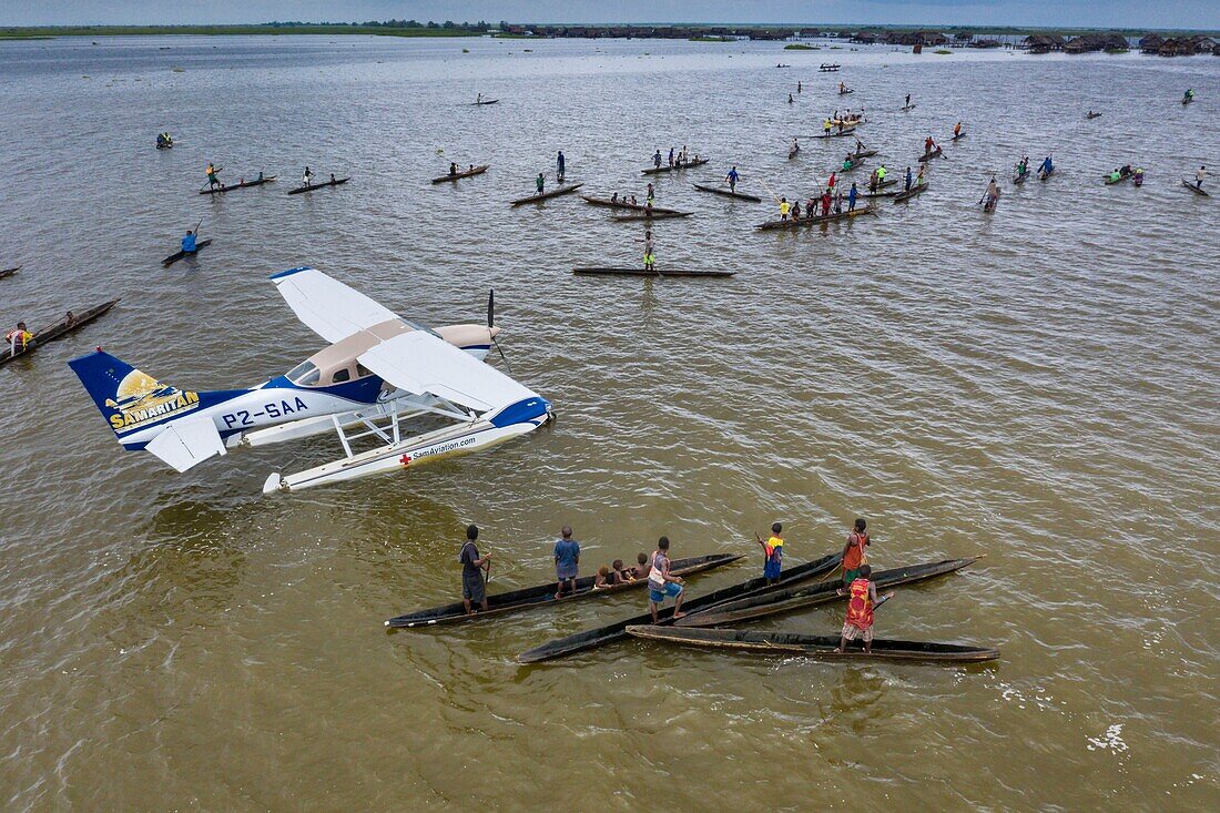 Papua New Guinea, East Sepik Province, Sepik River Region, Kambalamba village, Luke Hammer of the Samaritan Aviation Missionary Company and Dr. Preston Karue deliver Polio Vaccines by Seaplane in the Sepik River Area during the Eradication Campaign of the outbreak in 2019