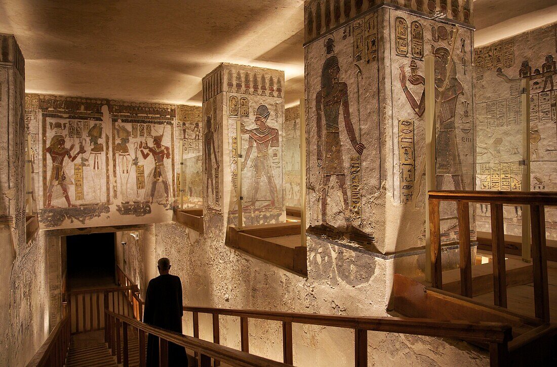 Egypt, Upper Egypt, Nile Valley, Luxor, Valley of the Kings, Guardian, descending the stairs leading to the crypt in the tomb of Ramses II