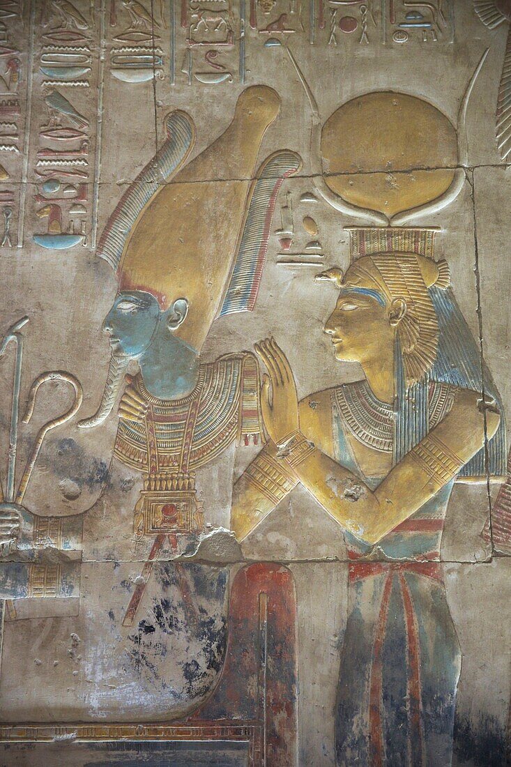 Egypt, Upper Egypt, Nile Valley, Dendera, color bas-relief depicting Pharaoh and the goddess Hathor engraved on a wall of the temple of Hathor