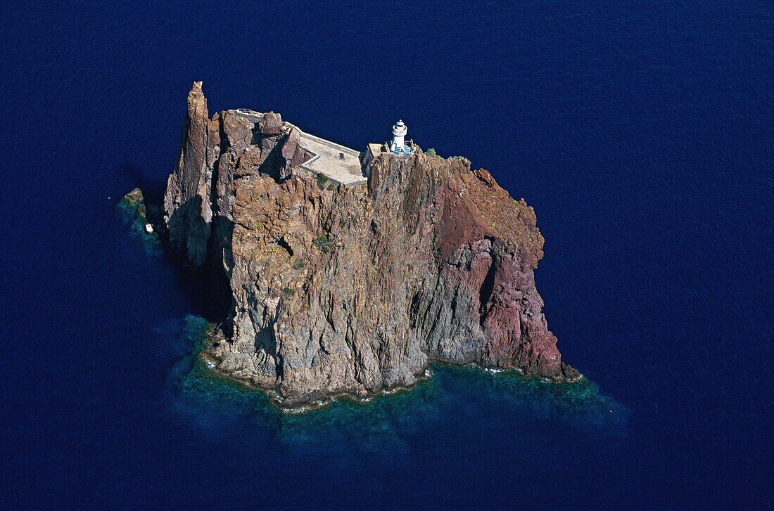 Italy, Aeolian Islands, Stromboli, Strombolicchio island from the sky (aerial view)