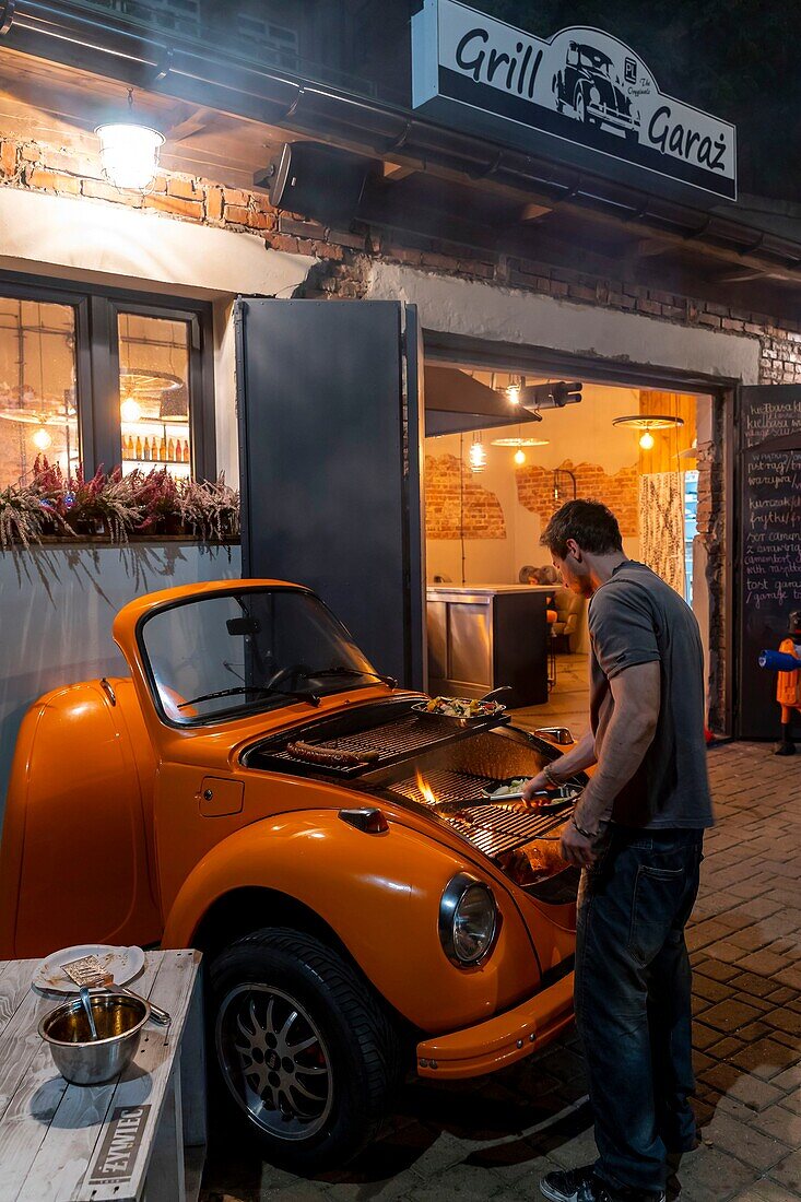 Poland, Voïvodie Lesser Poland, Krakow, Stare Miasto district, World Heritage Site, Old Town, Tytano, a former industrial complex converted into an outlet with bars and discotheque, Volkswagen Beetle transformed into a barbecue